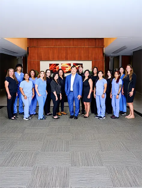 Smiling oral surgeons and team members at Piney Point Oral and Maxillofacial Surgery of Houston