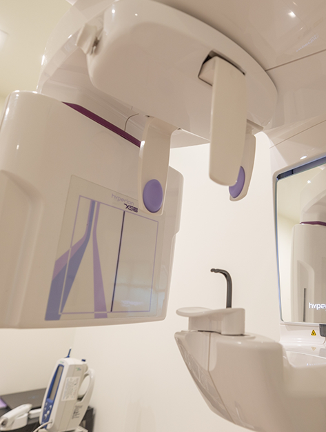 CT scanning machine standing against a wall in oral surgery office in Houston