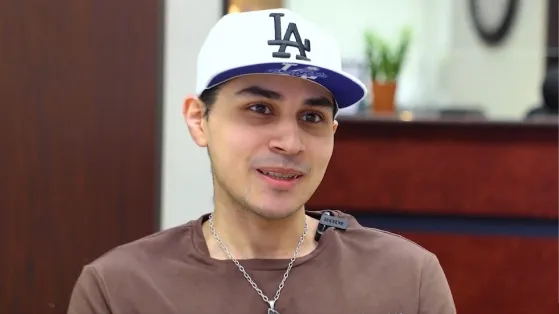Man in a Dodgers cap sitting in Houston oral surgery office