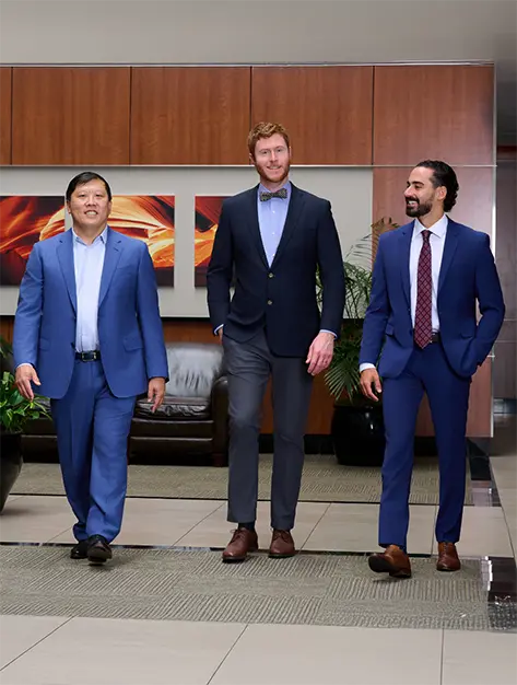 Two smiling Houston oral surgeons