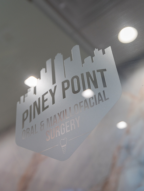 Piney Point Oral and Maxillofacial Surgery of Houston sign on the outside of the office door