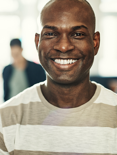 Smiling man in a striped T shirt