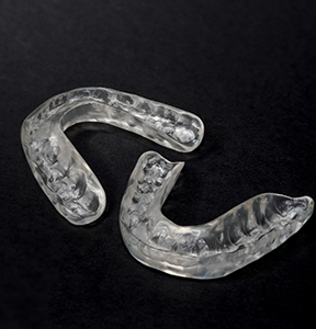 Two clear mouthguard trays