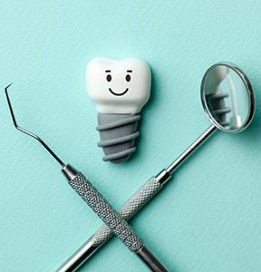 Illustrated dental implant with a smiling face next to a dental mirror and scaler