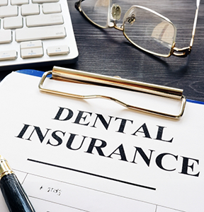 Dental insurance form on a clipboard