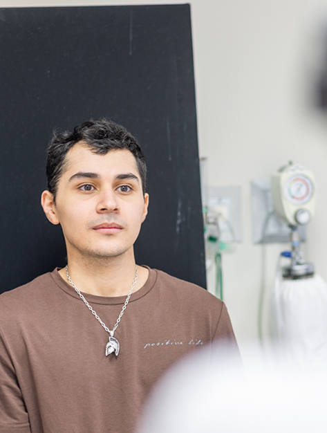 Young man sitting in an oral surgery office in Houston