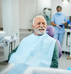 Senior man smiling in the dental chair